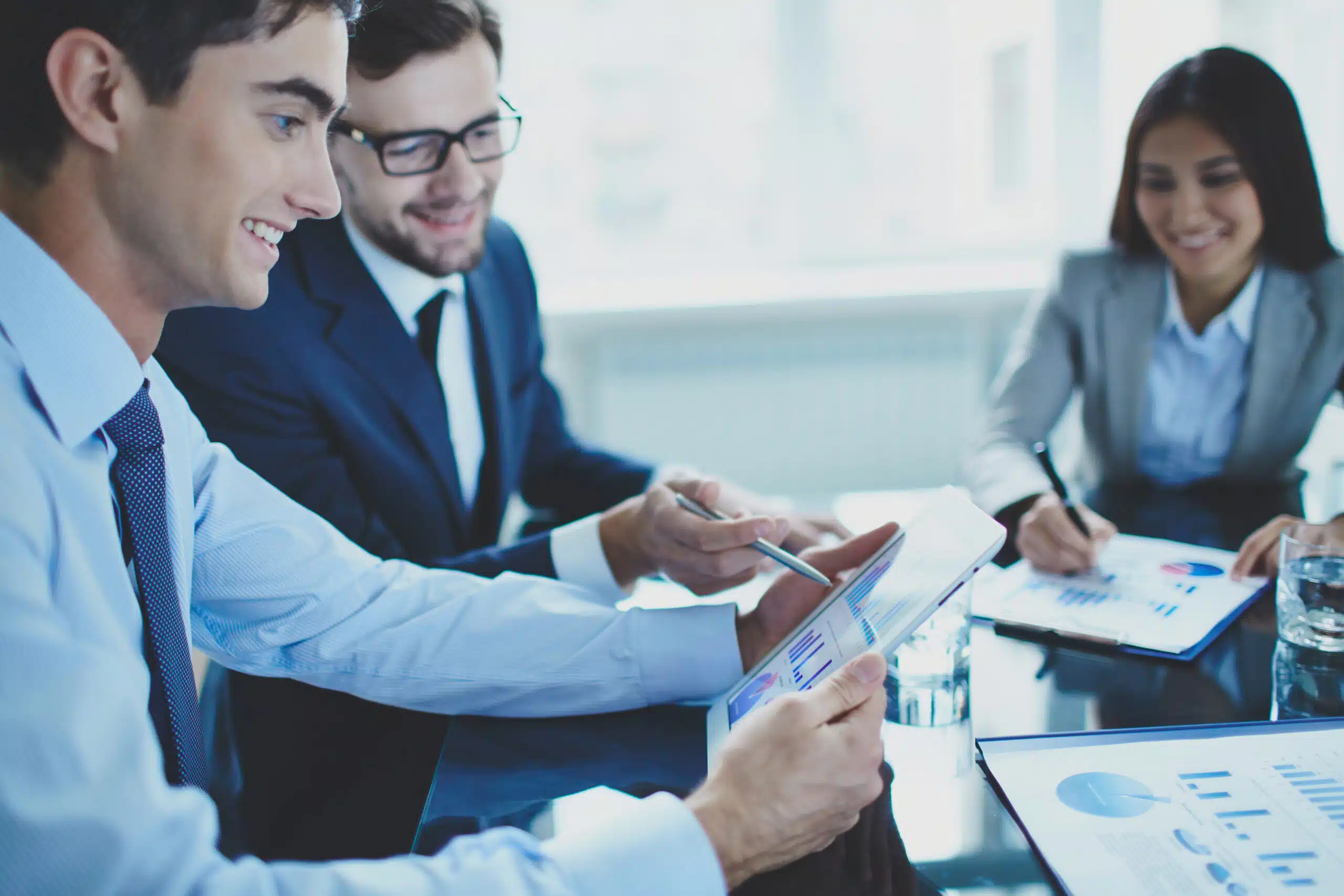 co workers reviewing reports scaled
